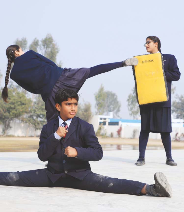 Students training in martial arts on the campus