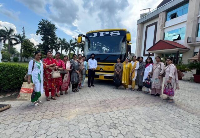 JPS Academy staff with the new air-conditioned bus on the Karnal route